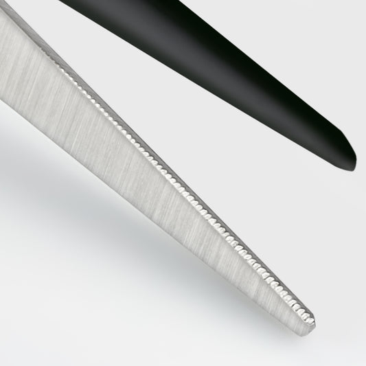 Black hairdressing scissors with an ergonomic design.