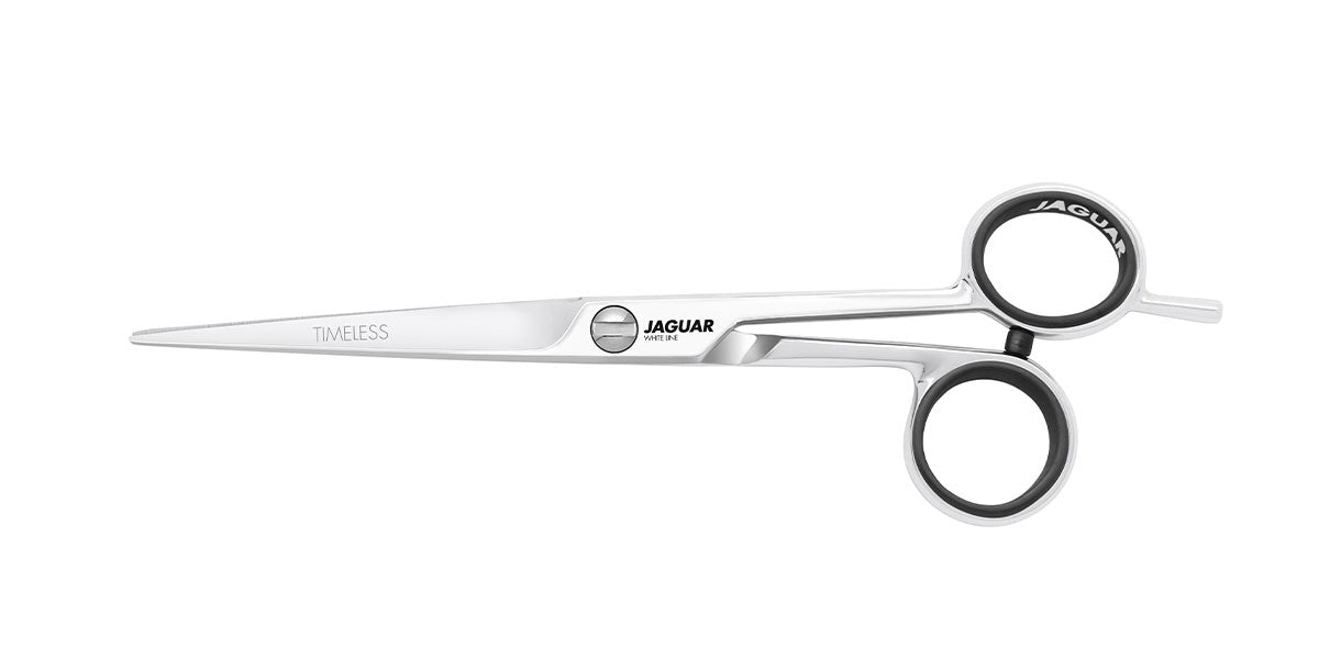 Hairdressing scissors with black handles.