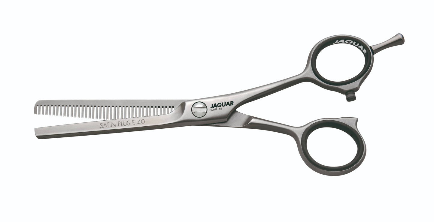 Hairdressing scissors with serrated blades.