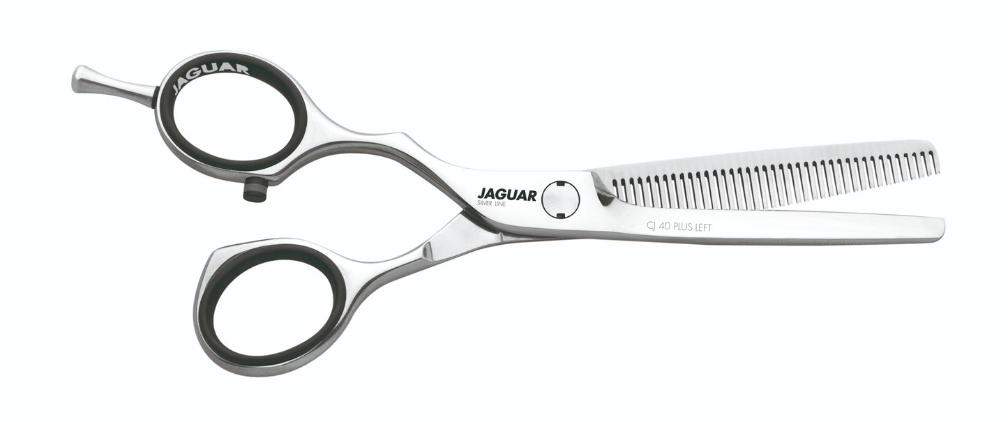 Hairdressing scissors with serrated blades.