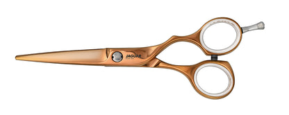 Golden hairdressing scissors with finger hook.