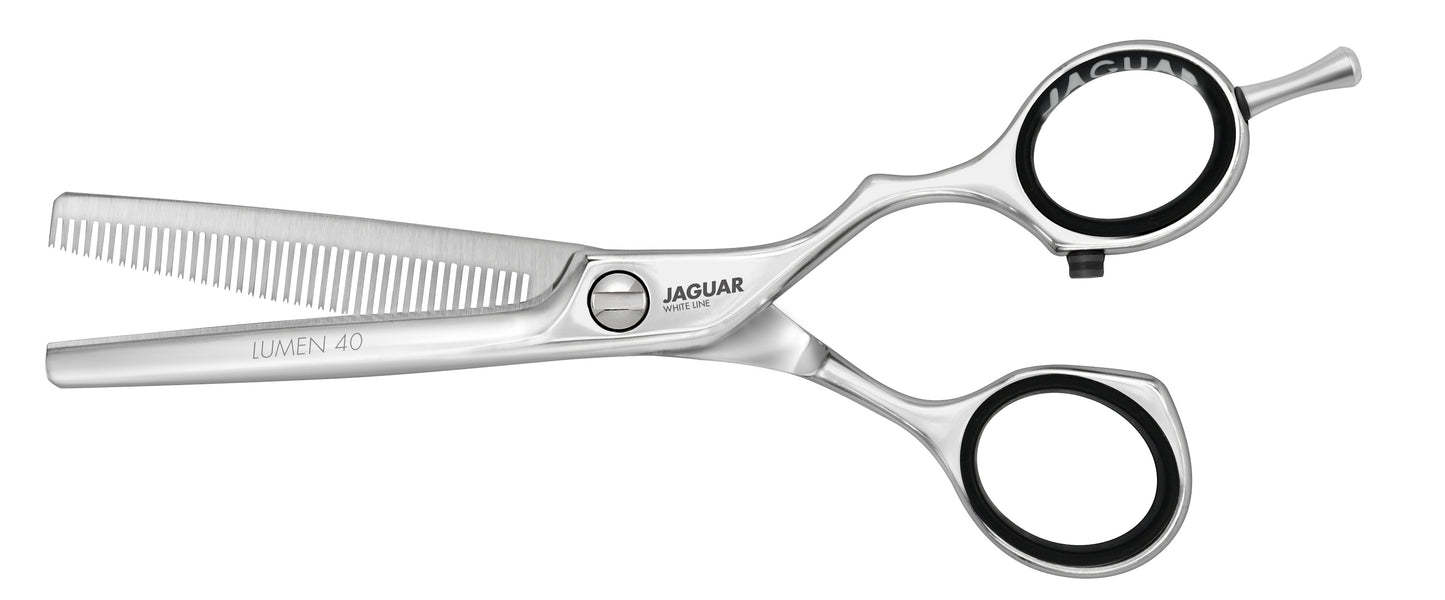 Hairdressing scissors with serrated blades.