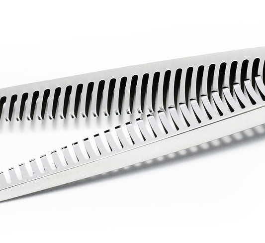 Hairdressing scissors with serrated blades.