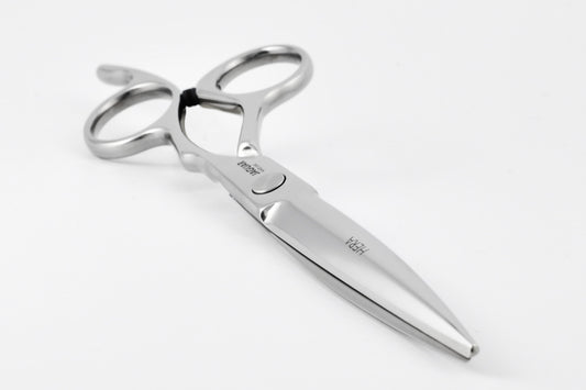 Hairdressing scissors with ergonomic design.