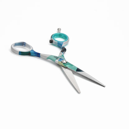 Colorful hairdressing scissors with pattern.