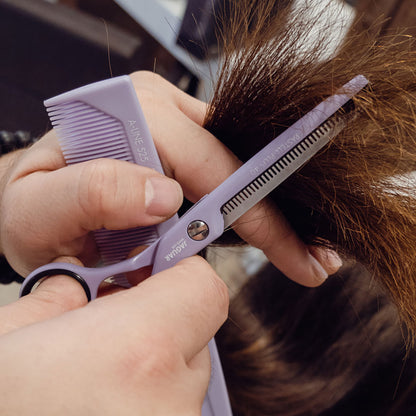Lavender-colored hairdressing scissors with offset.