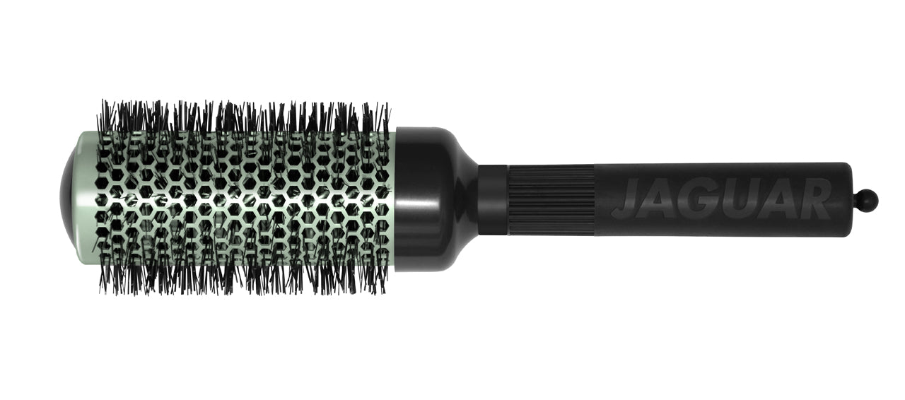 Four colorful round brushes for hairdressers.