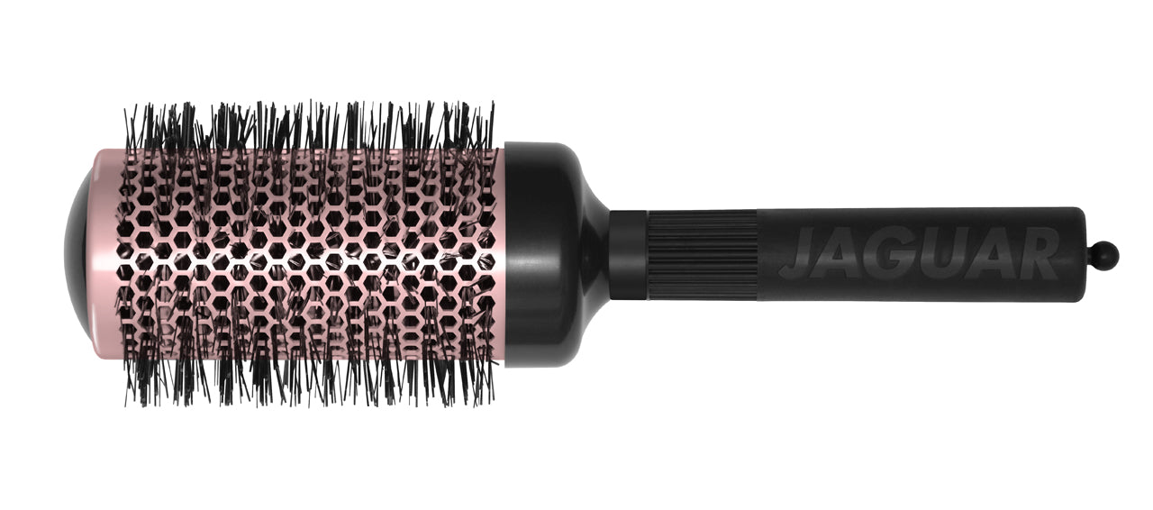 Four colorful round brushes for hairdressers.