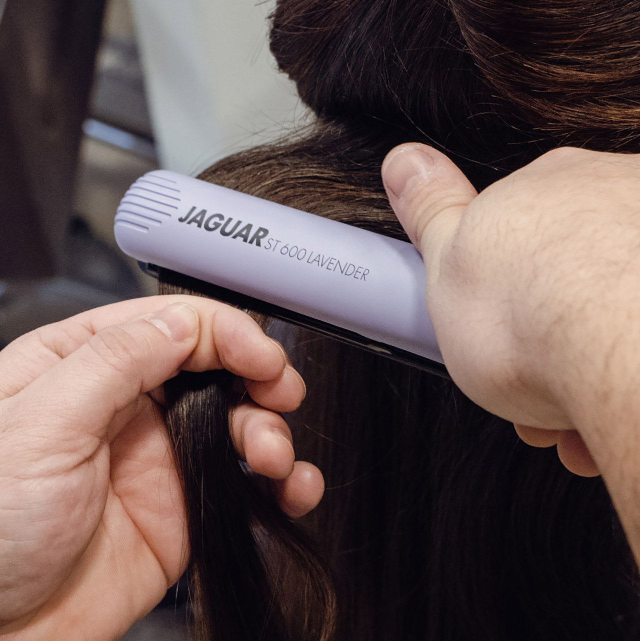 Lavender-colored hair straightener.