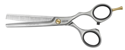 Hairdressing scissors with serrated blades.