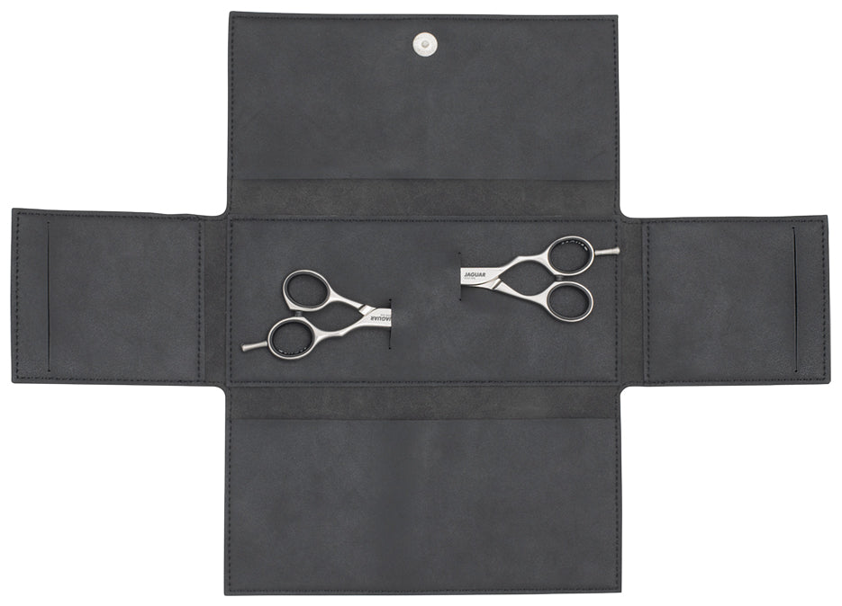 Open scissor case with two pairs of scissors.