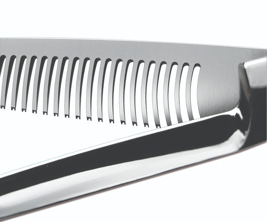 Hairdressing scissors with serrated blades.