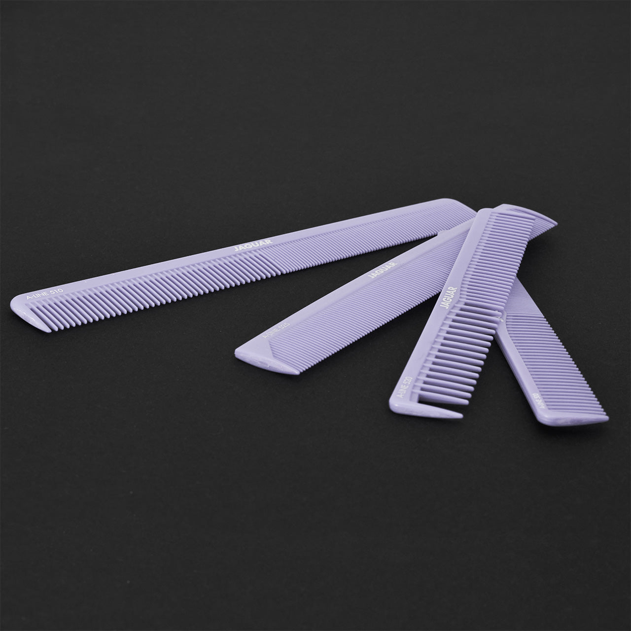 Purple combs in a black bag.