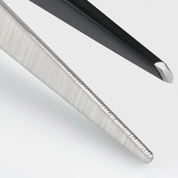 Hairdressing scissors with black handles.