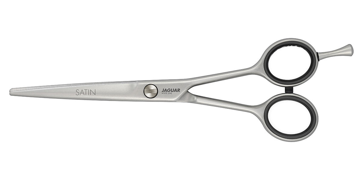 Hairdressing scissors with black handles.