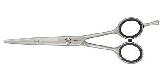 Hairdressing scissors with black handles.