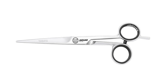 Hairdressing scissors with black handles.