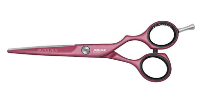 Pink hairdressing scissors with offset handle.