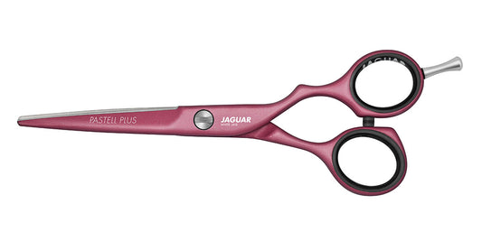 Pink hairdressing scissors with offset handle.