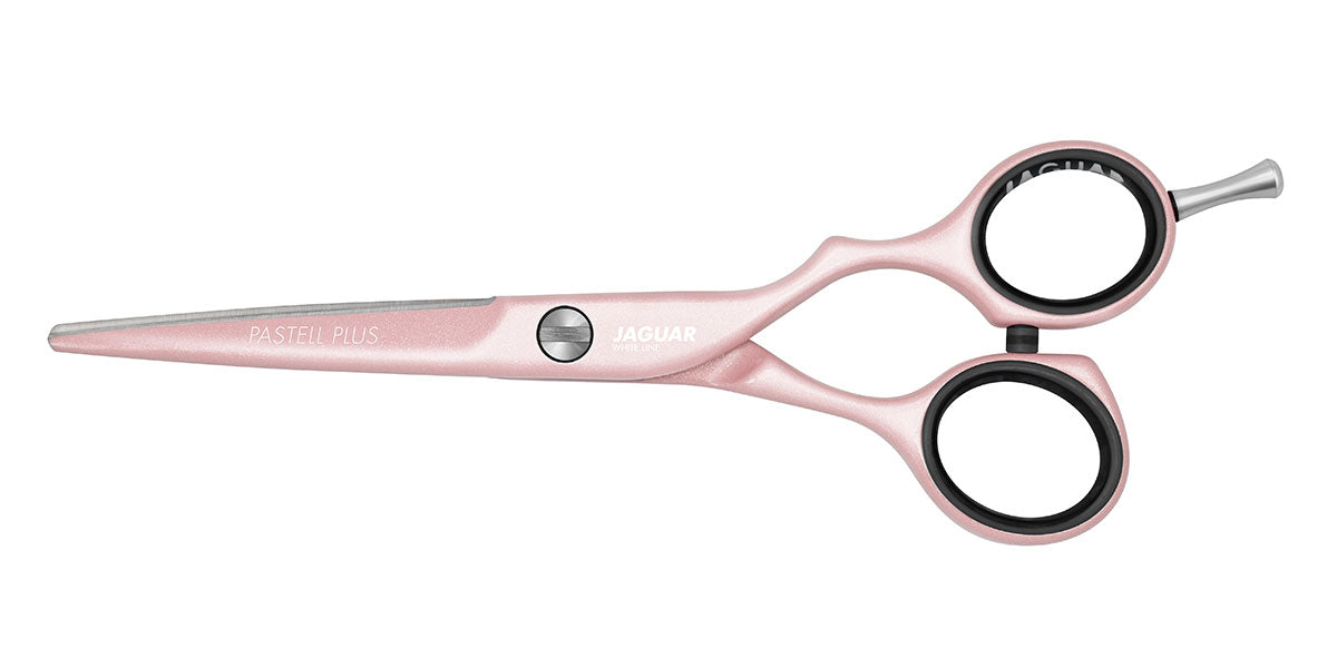 Pink hairdressing scissors with offset.
