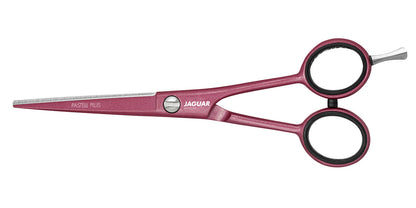 Pink hairdressing scissors with offset handle.