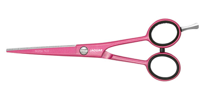 Pink hairdressing scissors with offset handle.