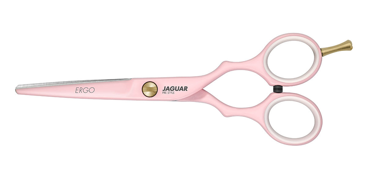 Pink hairdressing scissors with gold details.