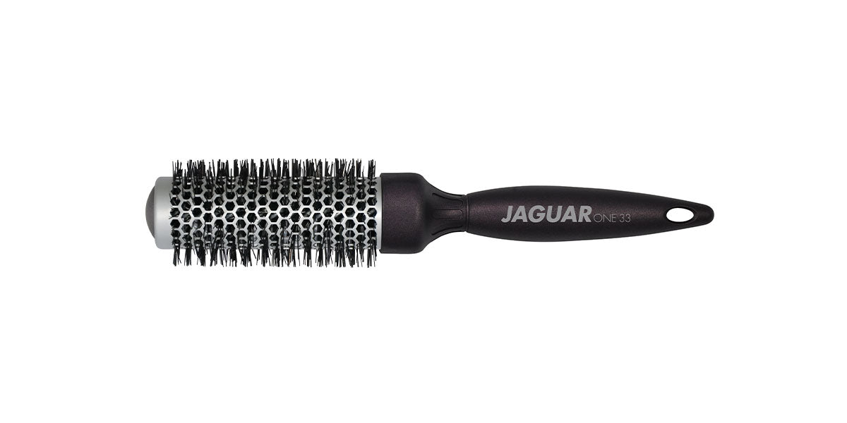 Round brush with black handle.