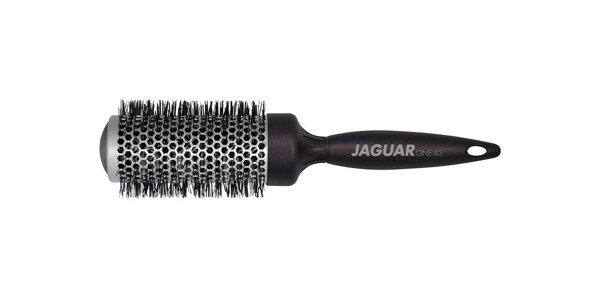 Round brush with black handle.