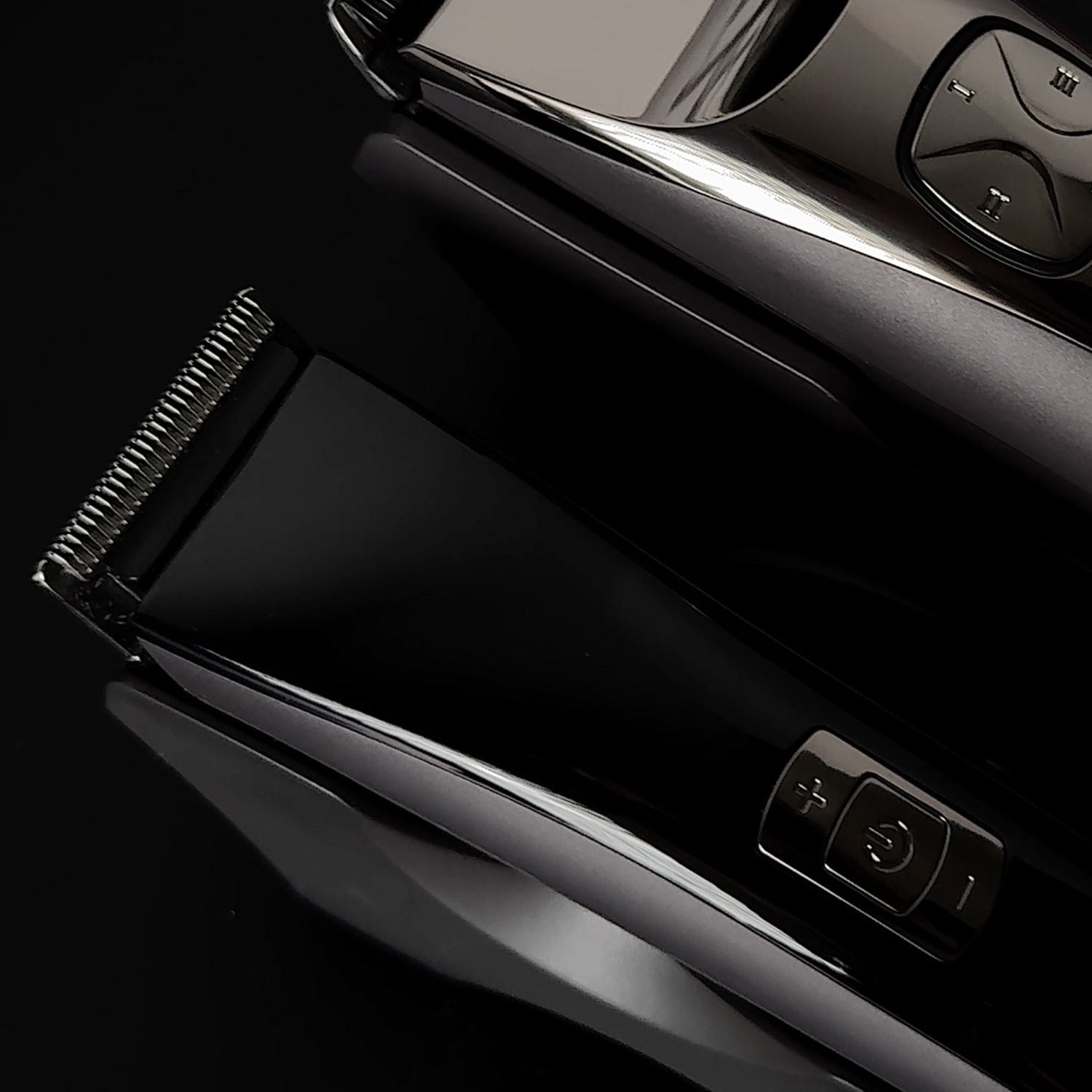 JAGUAR J-CUT and trimmer in glossy black, close-up view.