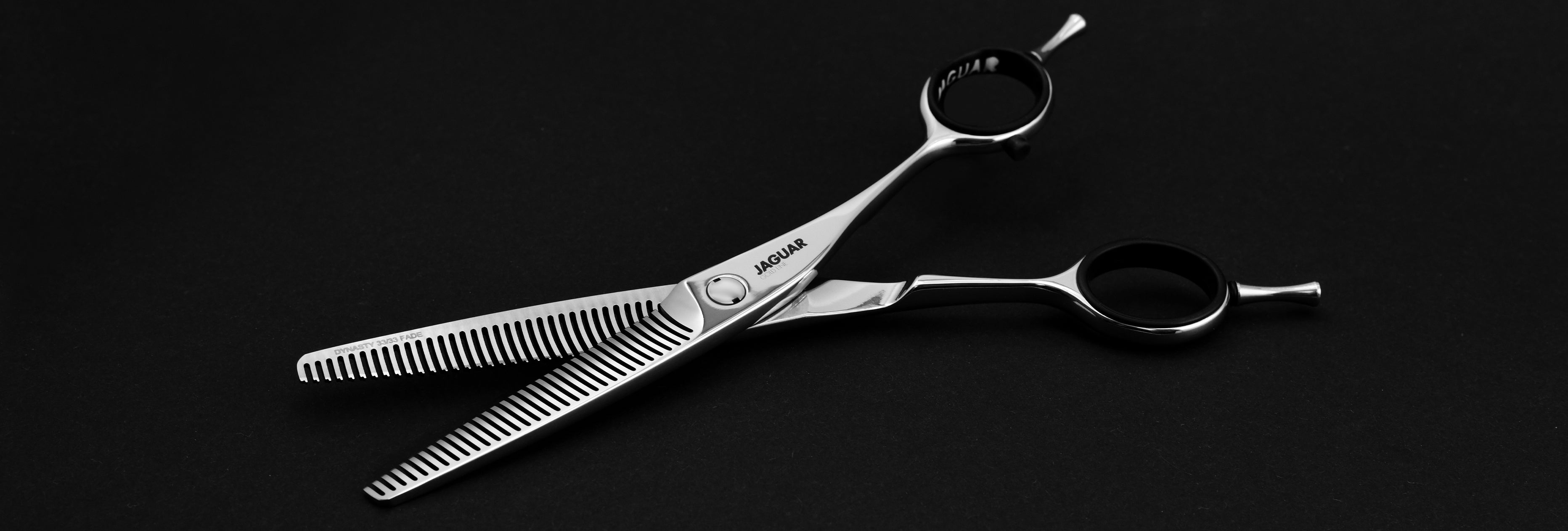 JAGUAR DYNASTY 33 thinning scissors from the Gold Line a black background, product shot.