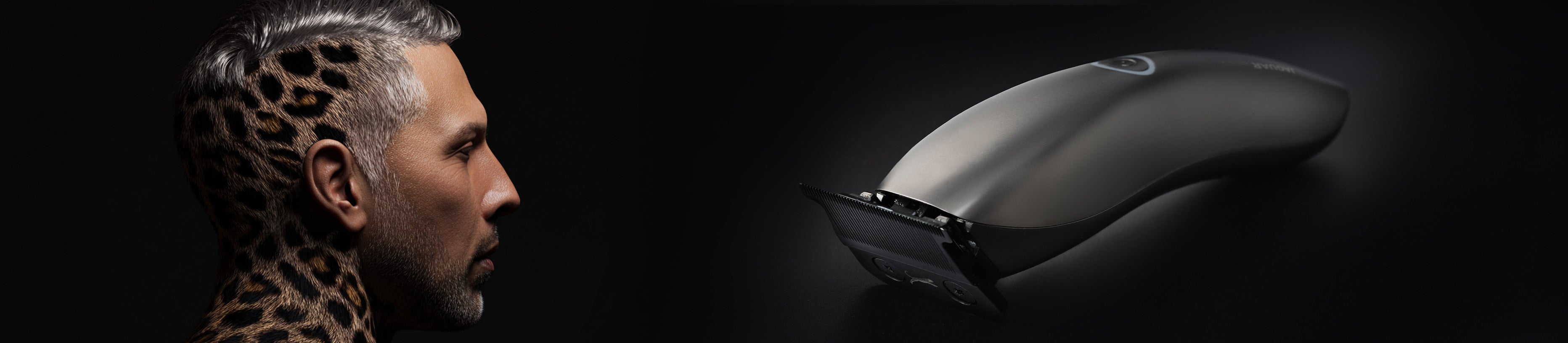 Artistic haircut with jaguar pattern and JAGUAR hair clipper, studio shot.