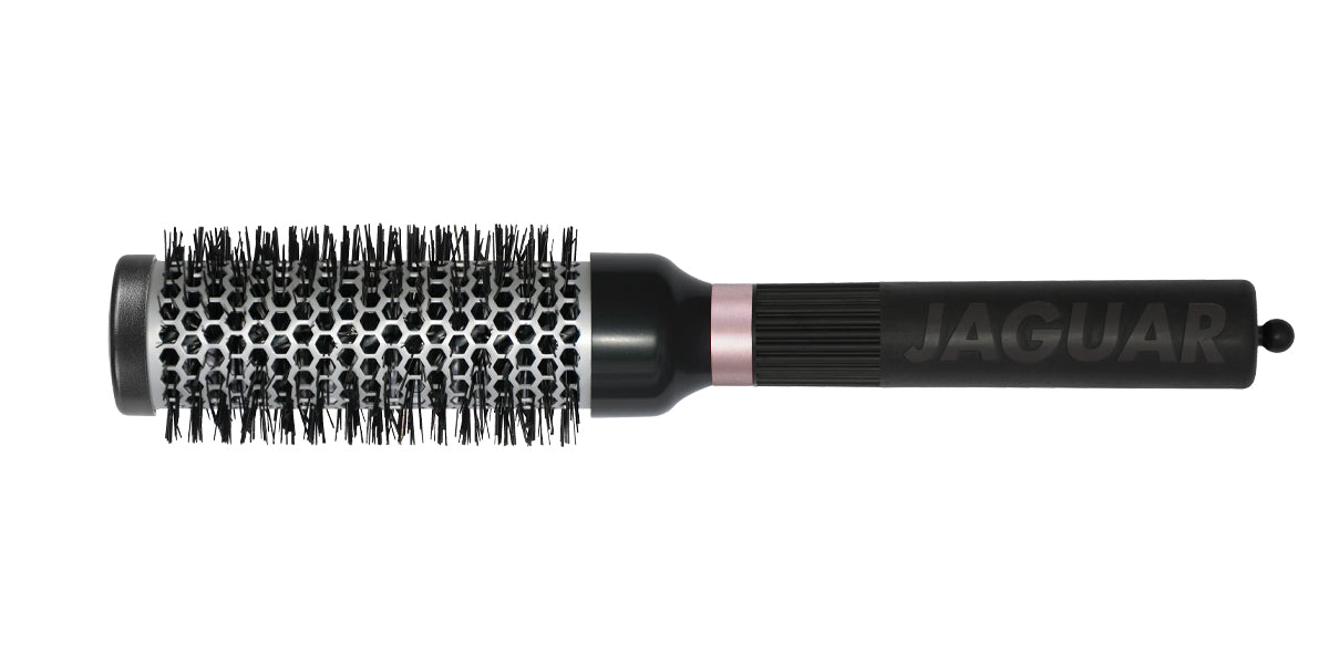 Round brush with black handle.