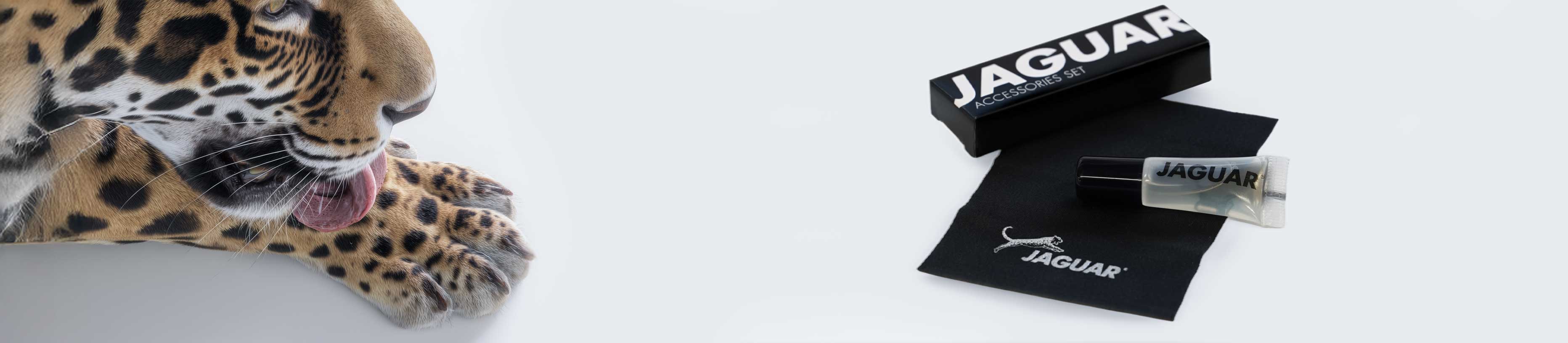 JAGUAR care set for hairdressing scissors with care oil, cleaning cloth, and accessories on a light background.