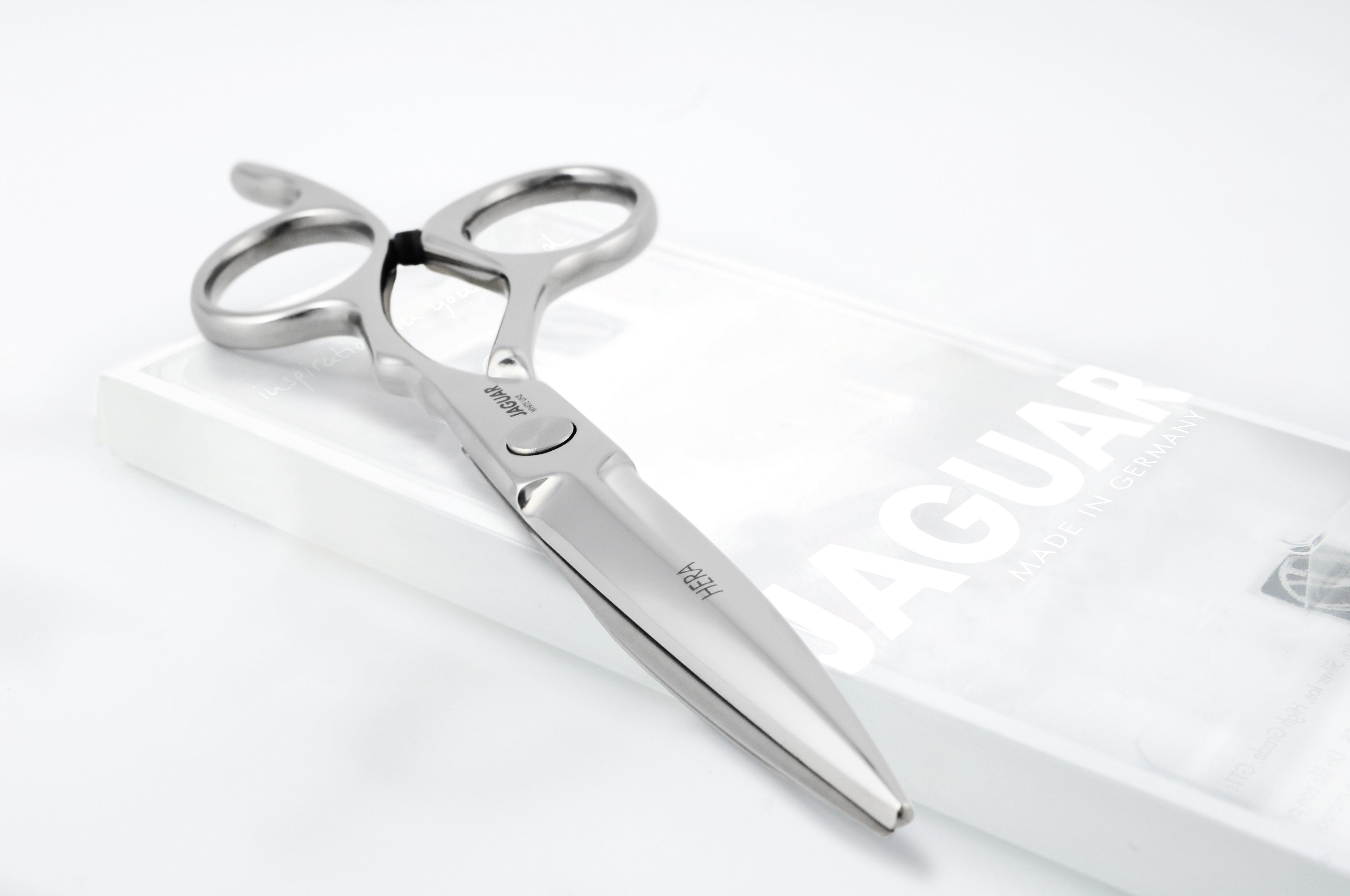 JAGUAR WhiteLine Emo hairdressing scissors on a white background.