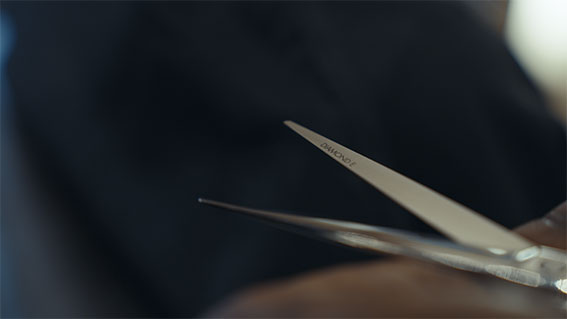 Hairdressing scissors with black handles.