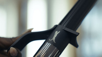 Curling iron with black handle.