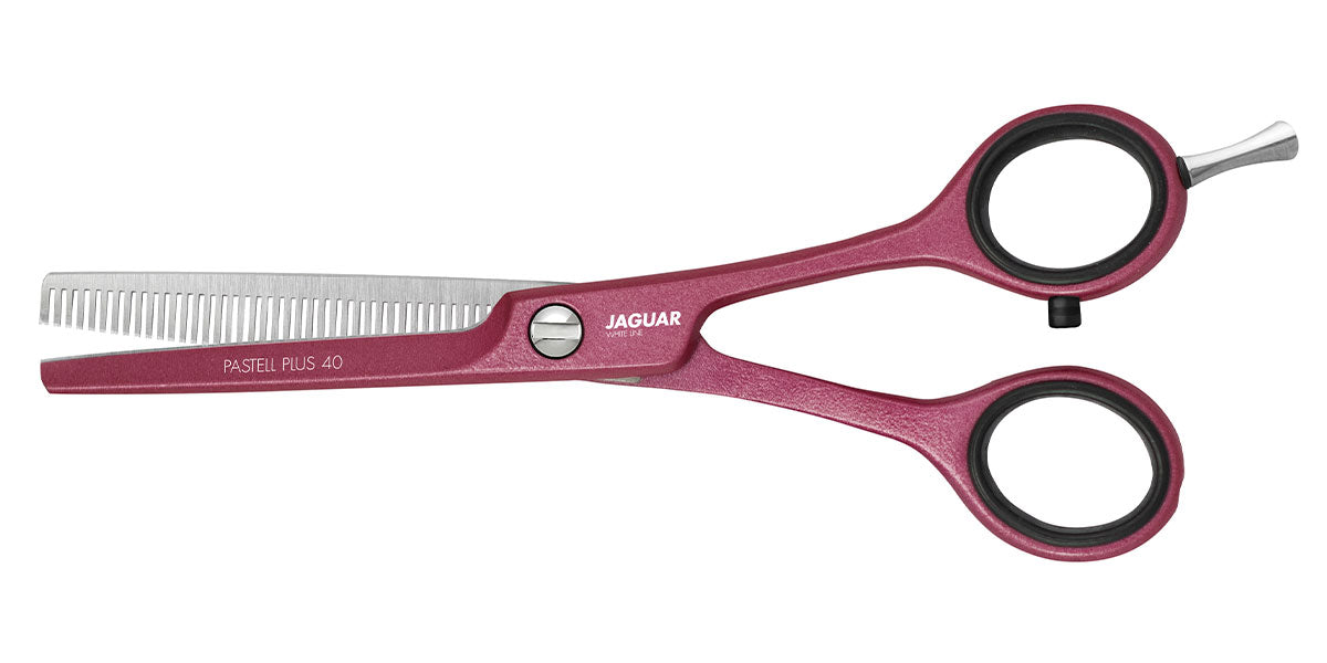 Modeling scissors in pink.