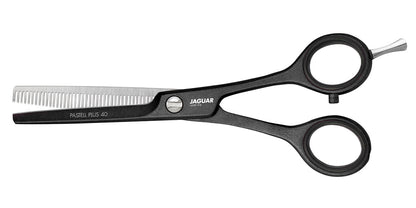 Hairdressing scissors with serrated blades.