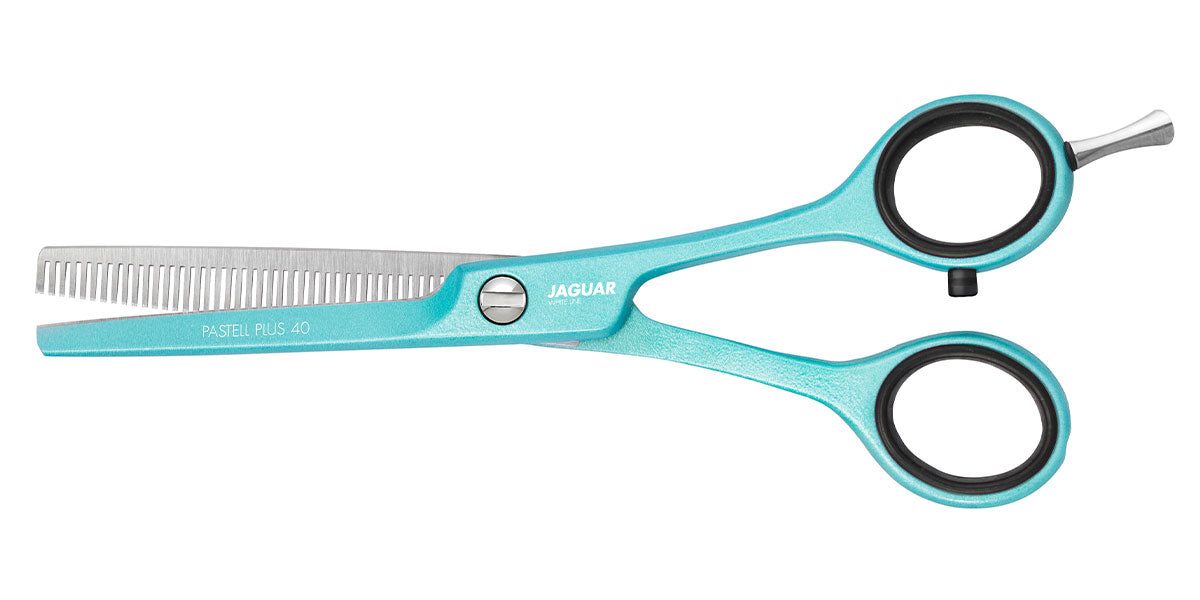 Mint green modeling scissors with offset.