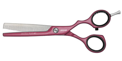 Modeling scissors in pink.
