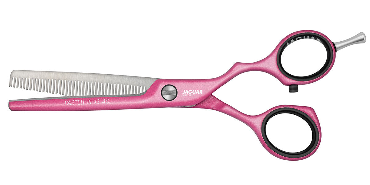 Pink modeling scissors for hairdressers.