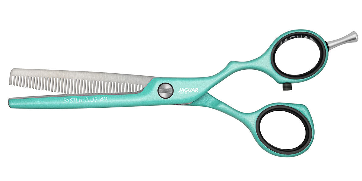 Mint green modeling scissors with offset.