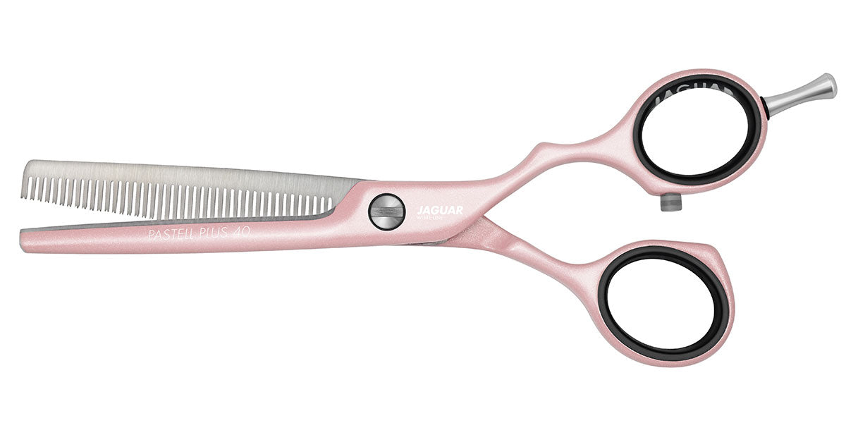 Pink modeling scissors for hairdressers.