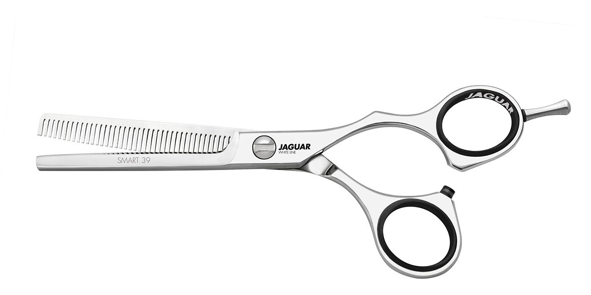 Hairdressing scissors with serrated blades.