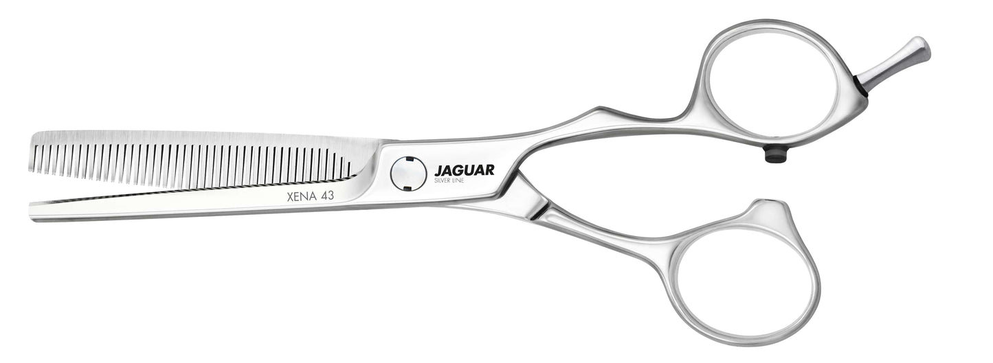 Hairdressing scissors with serrated blades.