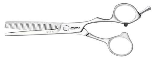 Hairdressing scissors with serrated blades.