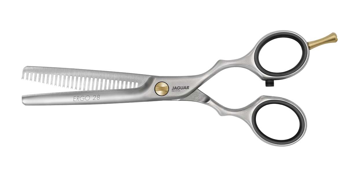Hairdressing scissors with serrated blades.