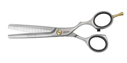 Friseurschere mit gezackter Klinge.