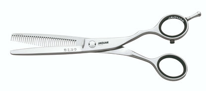 Hairdressing scissors with serrated blades.